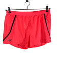 Naisten Under Armour - Urheilushortsit, koko 38 - Oranssi ()