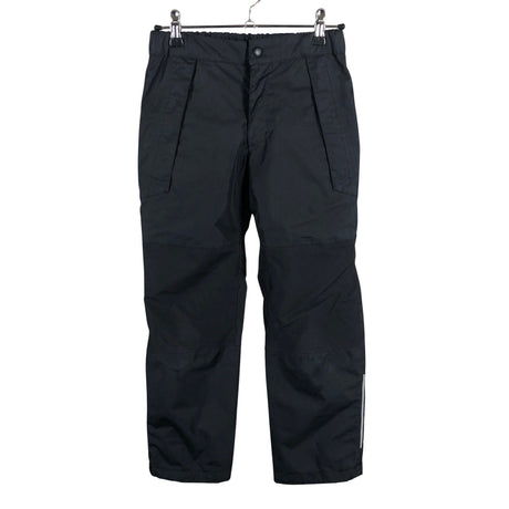 Unisex Reimatec - Välikausihousut, koko 134 - 140 - Musta ()