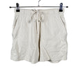 Naisten New Balance - Collegeshortsit, koko 34 - Luonnonvalkoinen ()