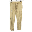 Unisex Gugguu - Collegehousut, koko 116 - 122 - Beige ()