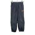 Unisex Nike - Ulkoiluhousut, koko 122 - 128 - Harmaa ()