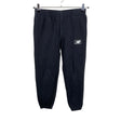 Unisex New Balance - Collegehousut, koko 152 - 158 - Musta ()