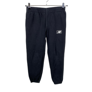 Unisex New Balance - Collegehousut, koko 152 - 158 - Musta (1)